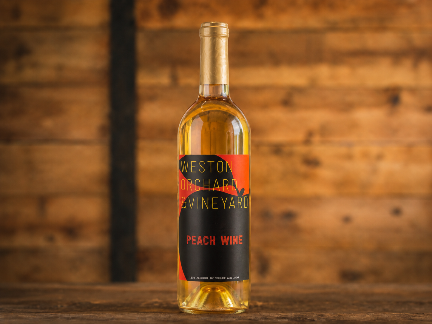 Three bottles of weston vineyard wine are on a table