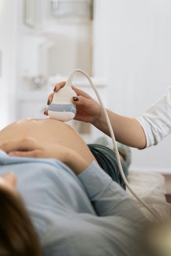 Ultrasound exam showing prenatal care and support during early pregnancy at women’s clinic