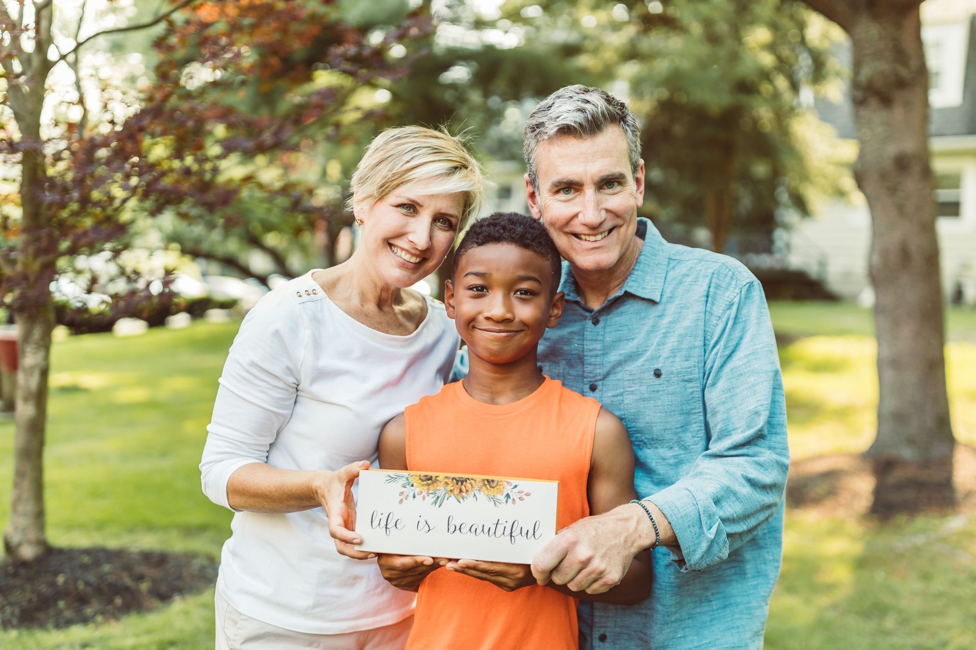 Three generations of a family embracing outdoors