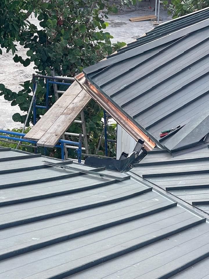 A close up of a roof with a wooden scaffolding on top of it.