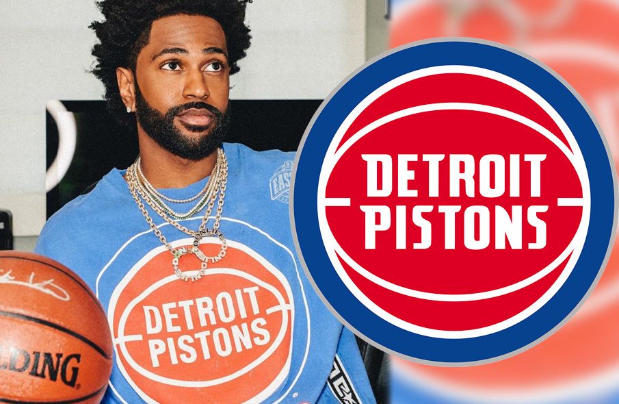 Detroit Pistons player in blue jersey holding a basketball, with team logo beside him.
