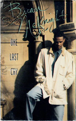 Album cover reading “One Last Cry,” with a man in a light coat leaning by a wall.