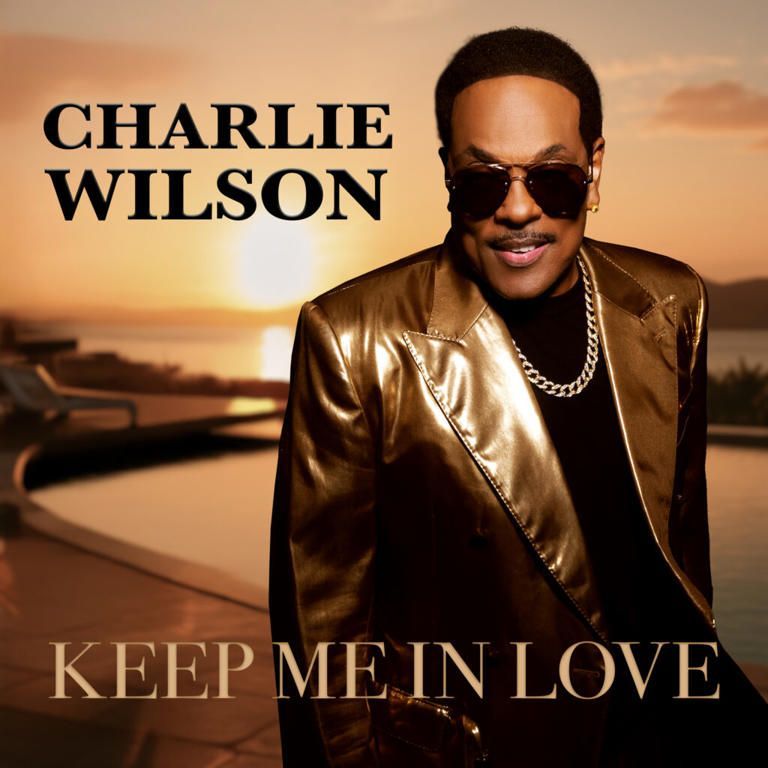 Charlie Wilson in a gold jacket and sunglasses with “Keep Me in Love” text over a sunset background
