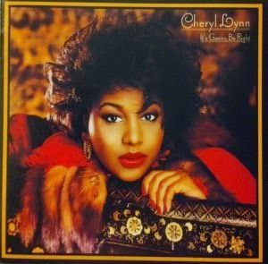 Book cover reading “Woman to Woman” by Shirley Brown, with mirrored portrait in a red-framed square.