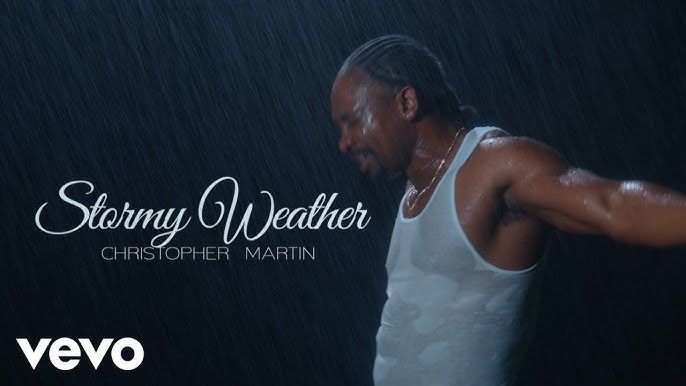Stormy Weather cover art with a singer in a white tank top in the rain and Vevo logo
