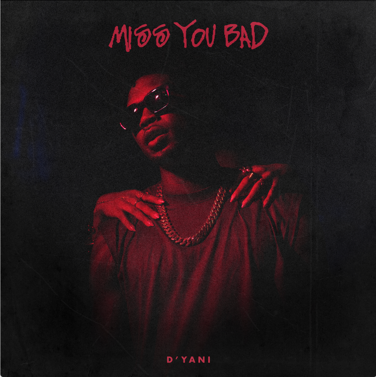 Red album cover with a person in sunglasses and chain; title “MISS YOU BAD” at top and “D’YANI” at bottom