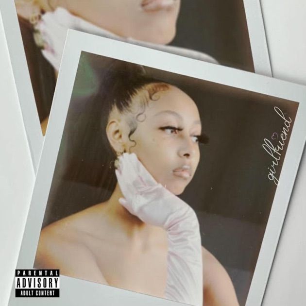 Album cover with a close-up portrait in a white frame, soft pink gloves, and “Parental Advisory” label.