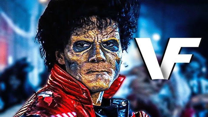 Close-up of Michael Jackson with a red jacket, blue face paint, and a large VF logo in the background
