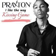 Album cover featuring Praxton in black shirt and tie with text “I like the way Kissing Game”