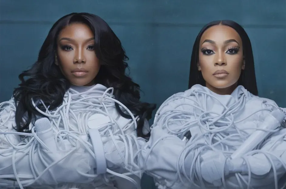 Two mirrored portraits of a person in a white layered outfit against a dark blue background