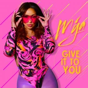 Woman in pink and black outfit with sunglasses against a bright pink background, text reads “Give It to You”