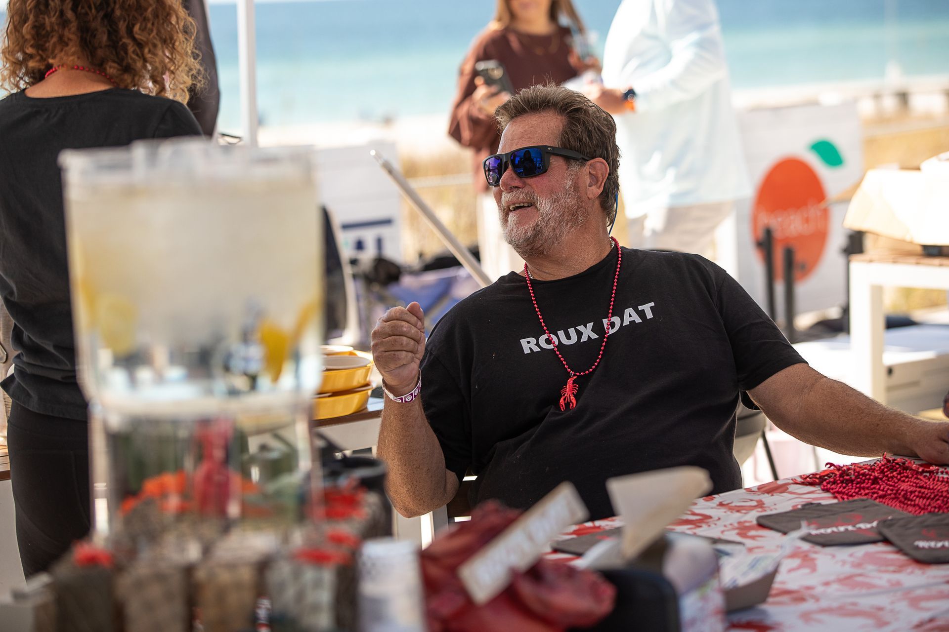 Man at the judges table at Gumbo Fest at Coastal Orange Beach