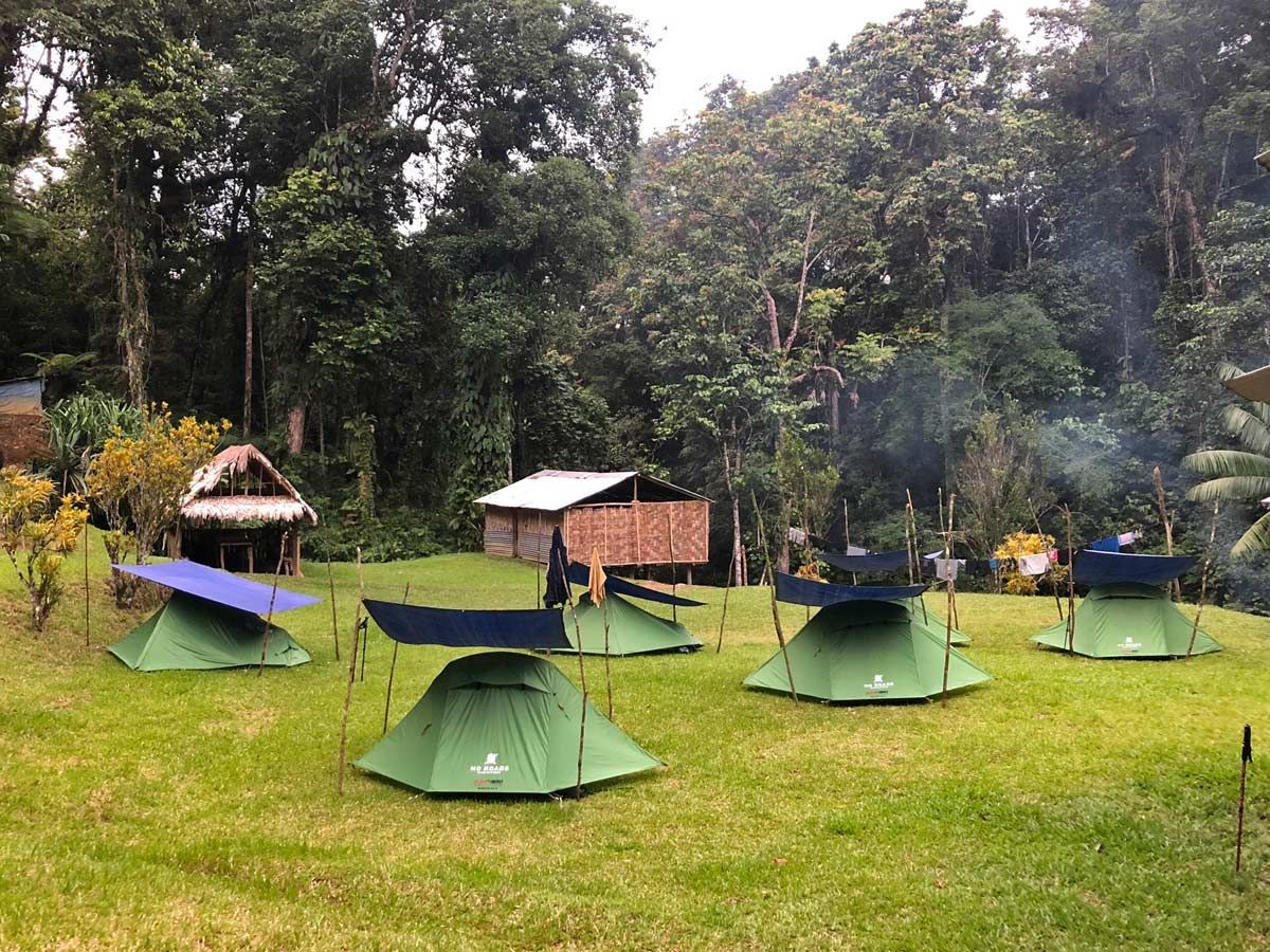 image depicts tents set up at the Wa-ule Creek campsite, the last night on the Kokoda Track.