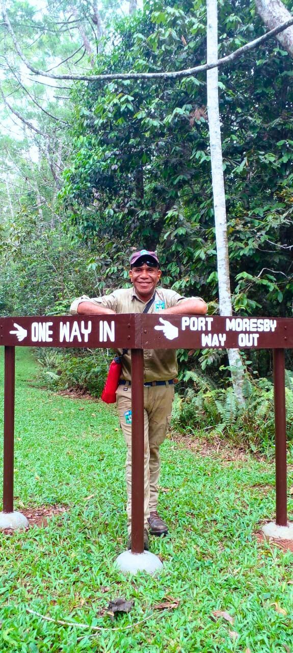 A sign for kokoda track with a blue sky in the background