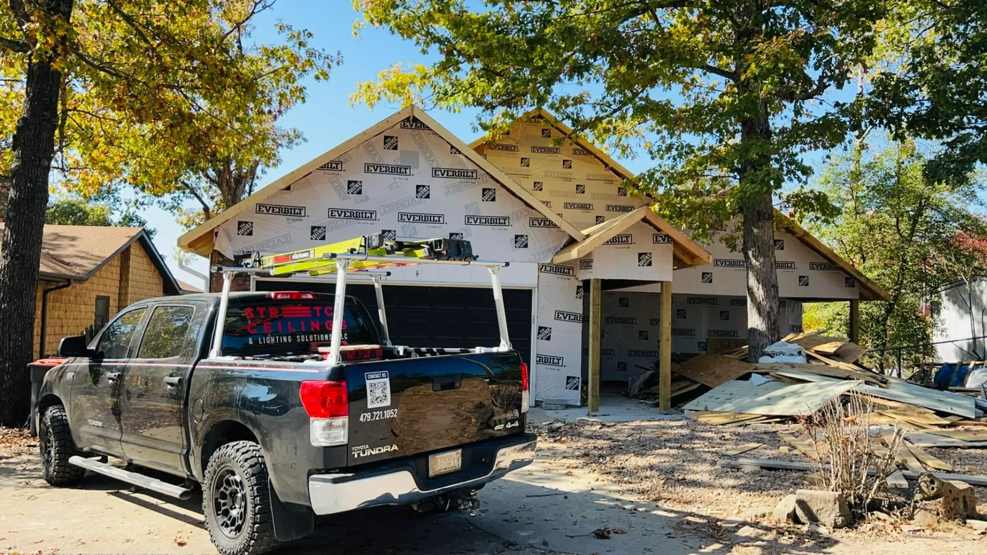 Company truck parked in front job site in Arkansas home