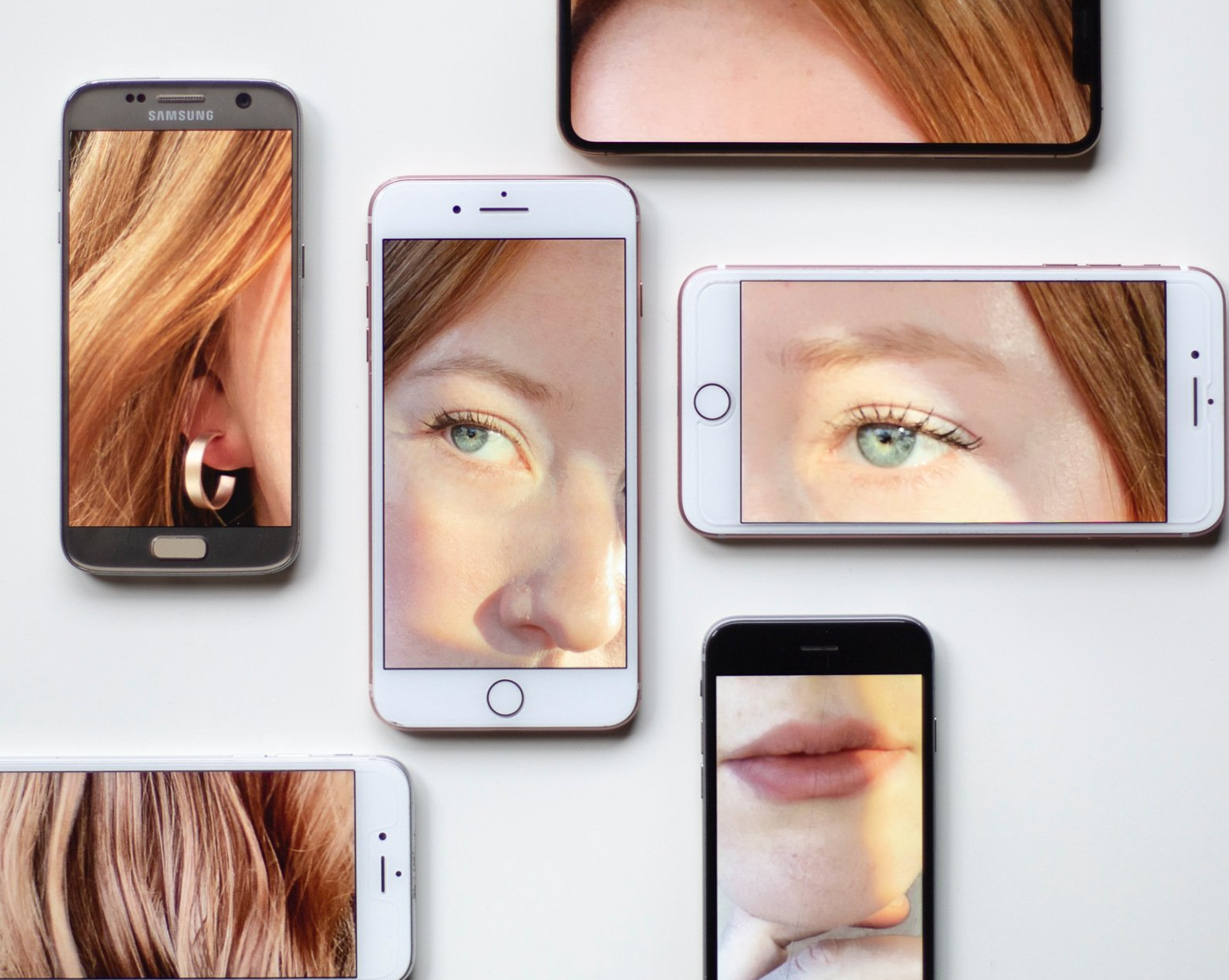 6 phones broken face red hair woman