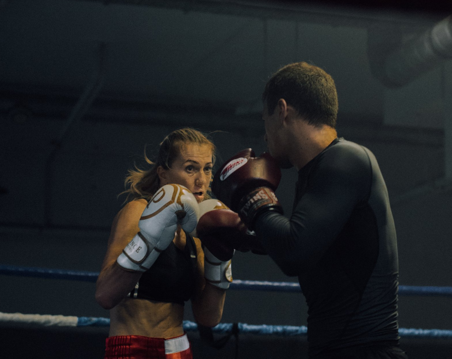 man and woman boxing ring