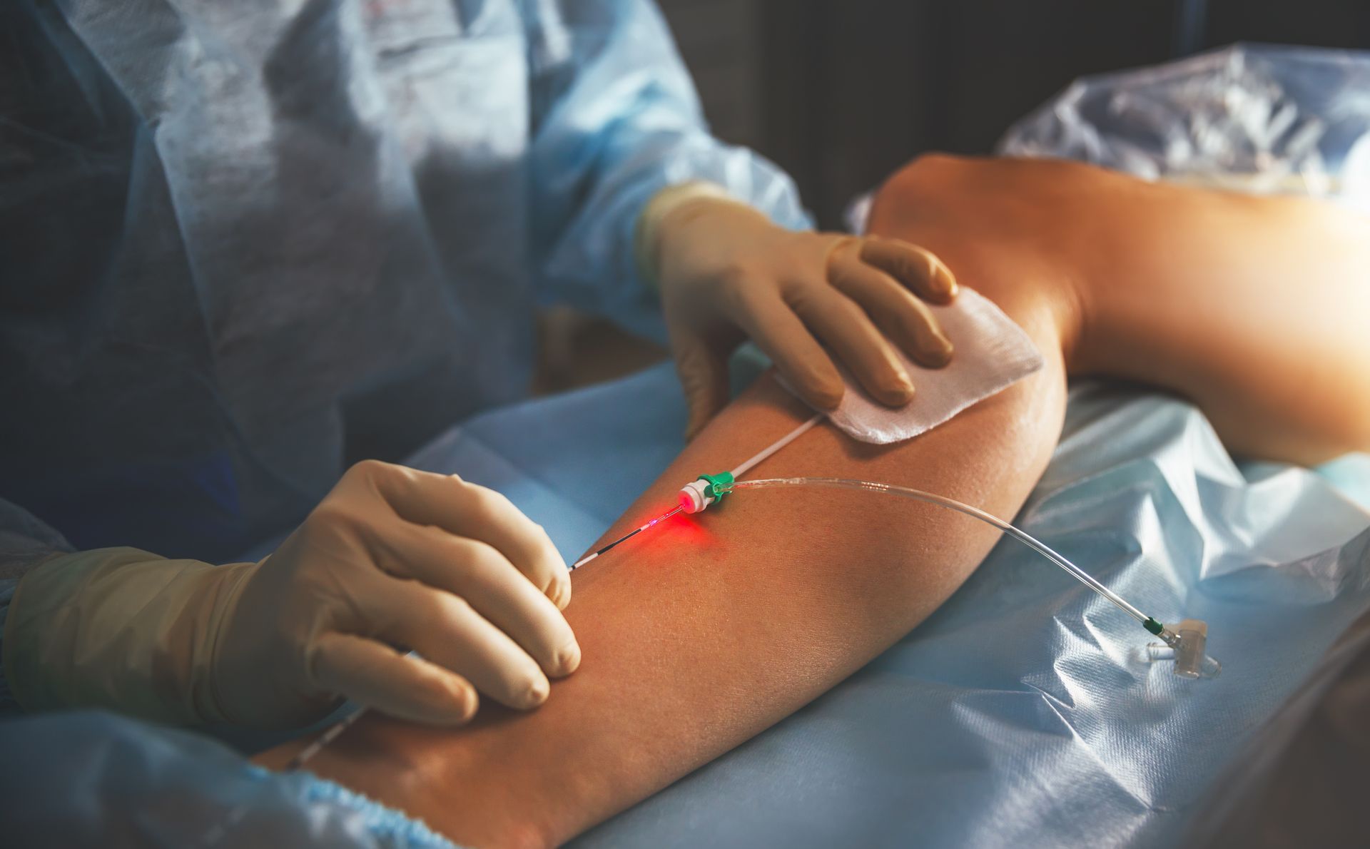 A medical professional performing a minimally invasive vein procedure.