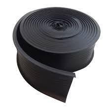 Black rubber coil, spiraling outward, used for construction, insulation, or sealing.