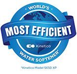 Blue circular Kinetico badge reading “World’s Most Efficient Water Softener” with a water droplet icon.