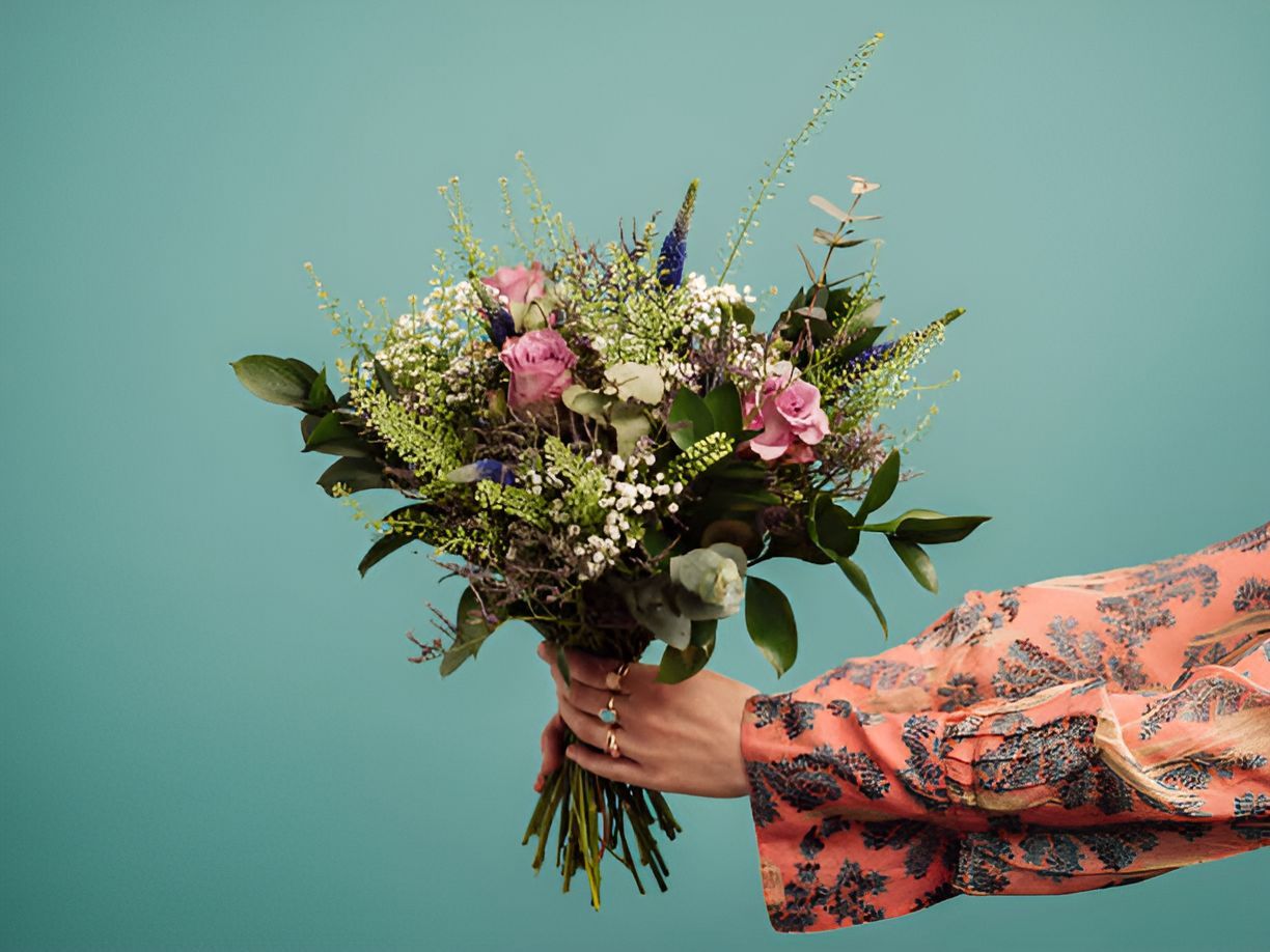 A Person is Holding a Bouquet of Flowers in Their Hands — Greenfield Blooms and Gifts In Wanguri, NT