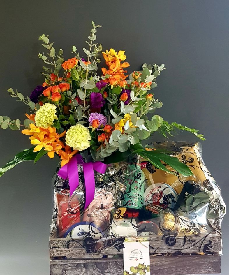 A Wooden Box Filled Wit h Flowers and a Purple Ribbon โ Greenfield Blooms and Gifts In Wanguri, NT