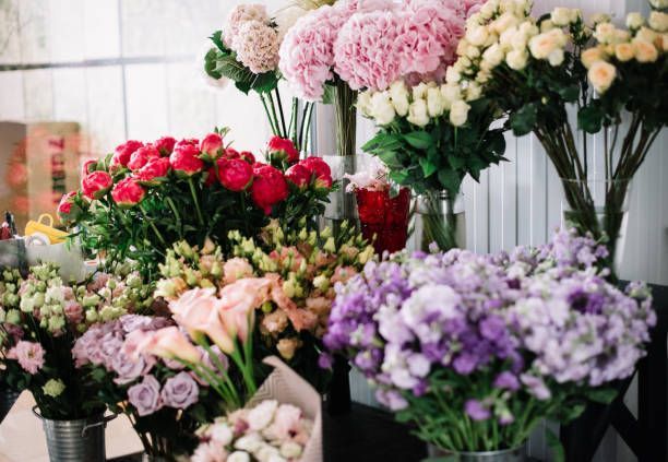 A Bunch of Different Types of Flowers Are Sitting on a Table — Greenfield Blooms and Gifts In Wanguri, NT