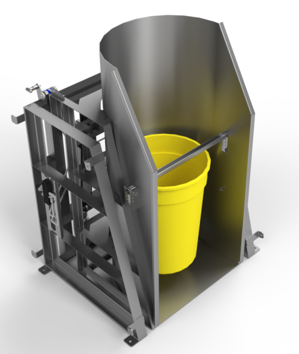 A yellow bucket is sitting inside of a machine
