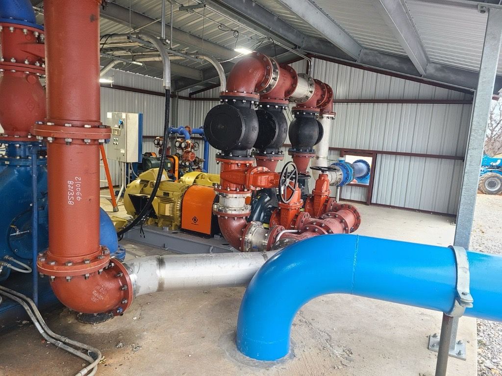 A bunch of pipes are connected to each other in a building.