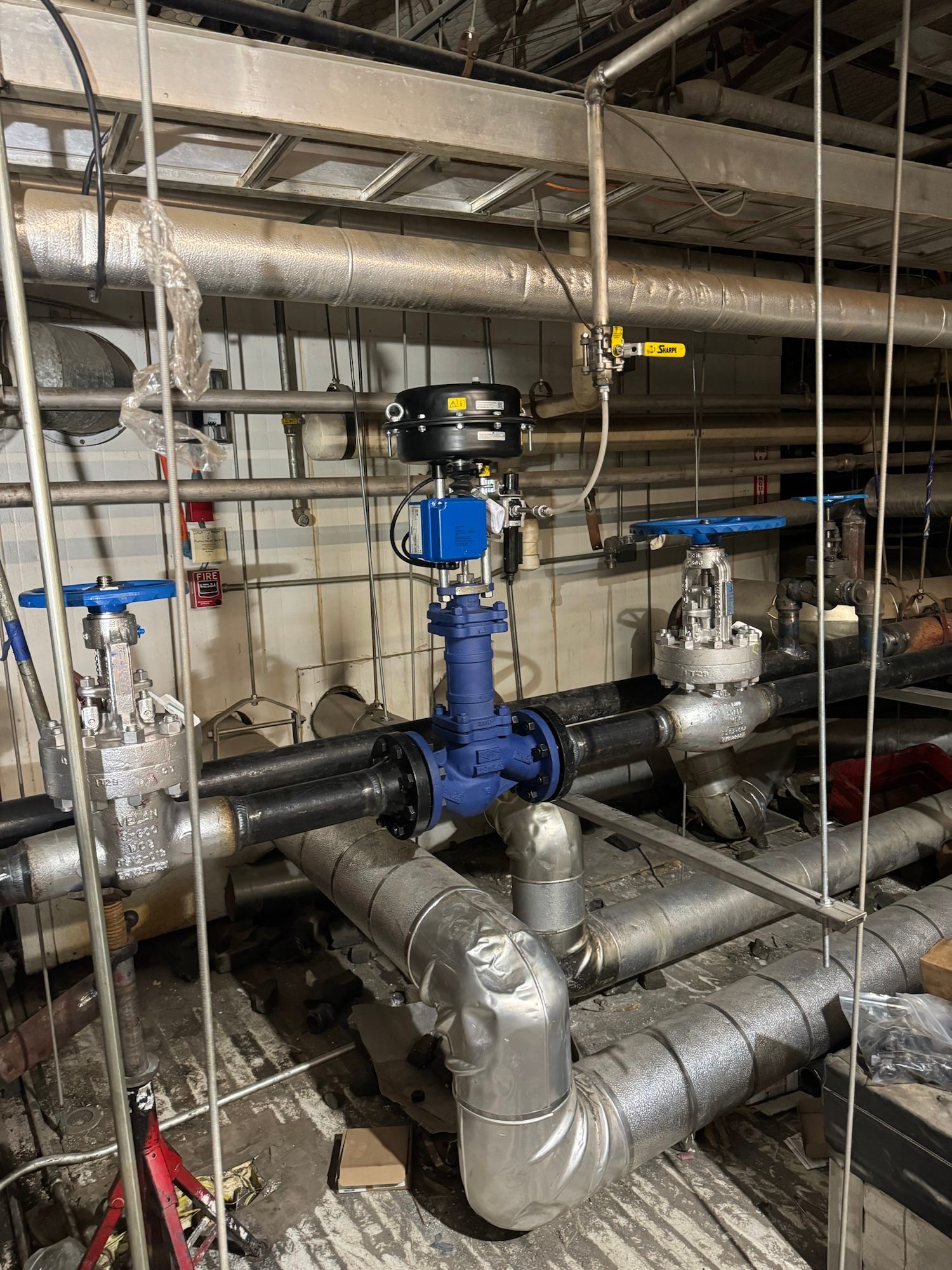 A room filled with lots of pipes and valves.