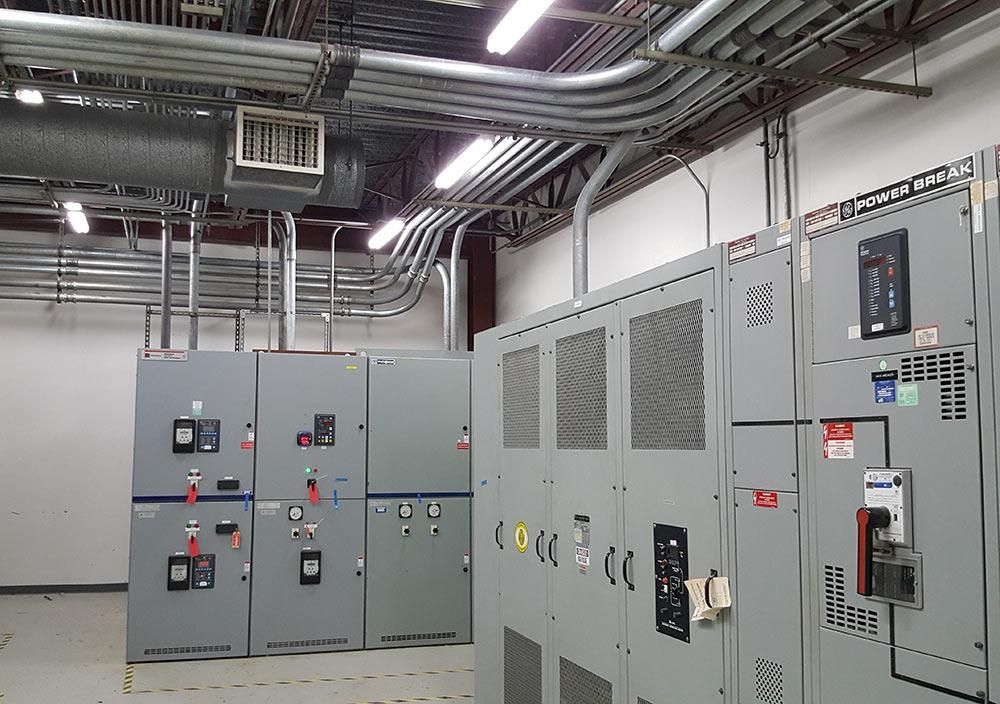 A room filled with lots of electrical boxes and pipes