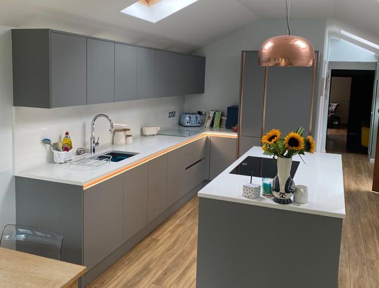 Modern grey kitchen with brass trims