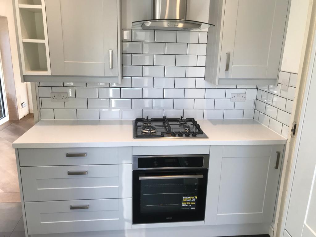 Traditional grey kitchens with metro tile splashback