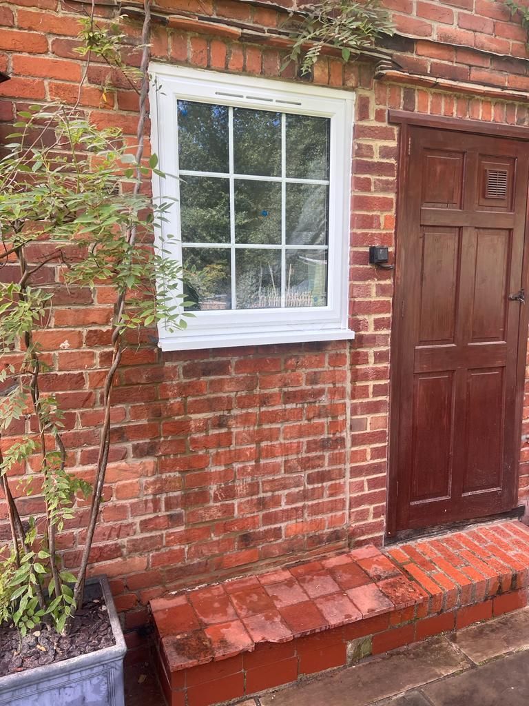 External door removed and replaced with new window and brickwork