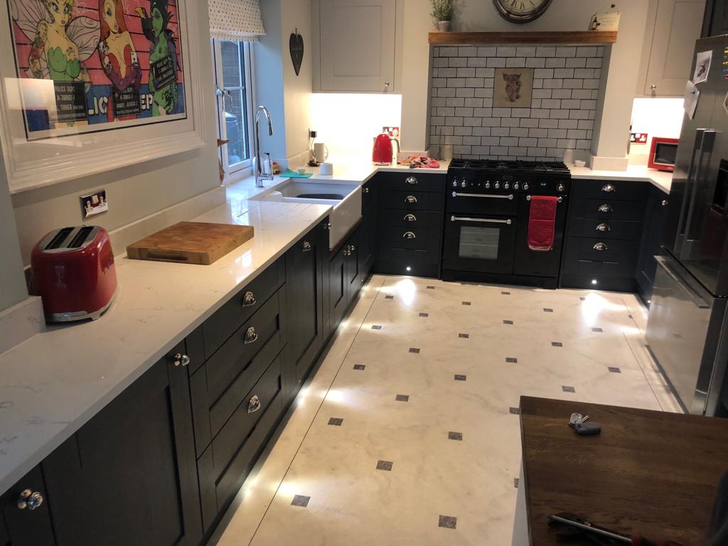Black Shaker style kitchen with metro tile splashback