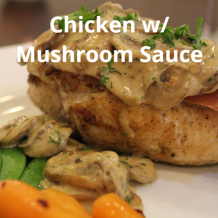 Juicy chicken breasts topped with prosciutto and covered in a rich mushroom sauce made with Marsala wine, heavy cream, mascarpone, garlic, and fresh parsley, served with button mushrooms and garnished with extra parsley.