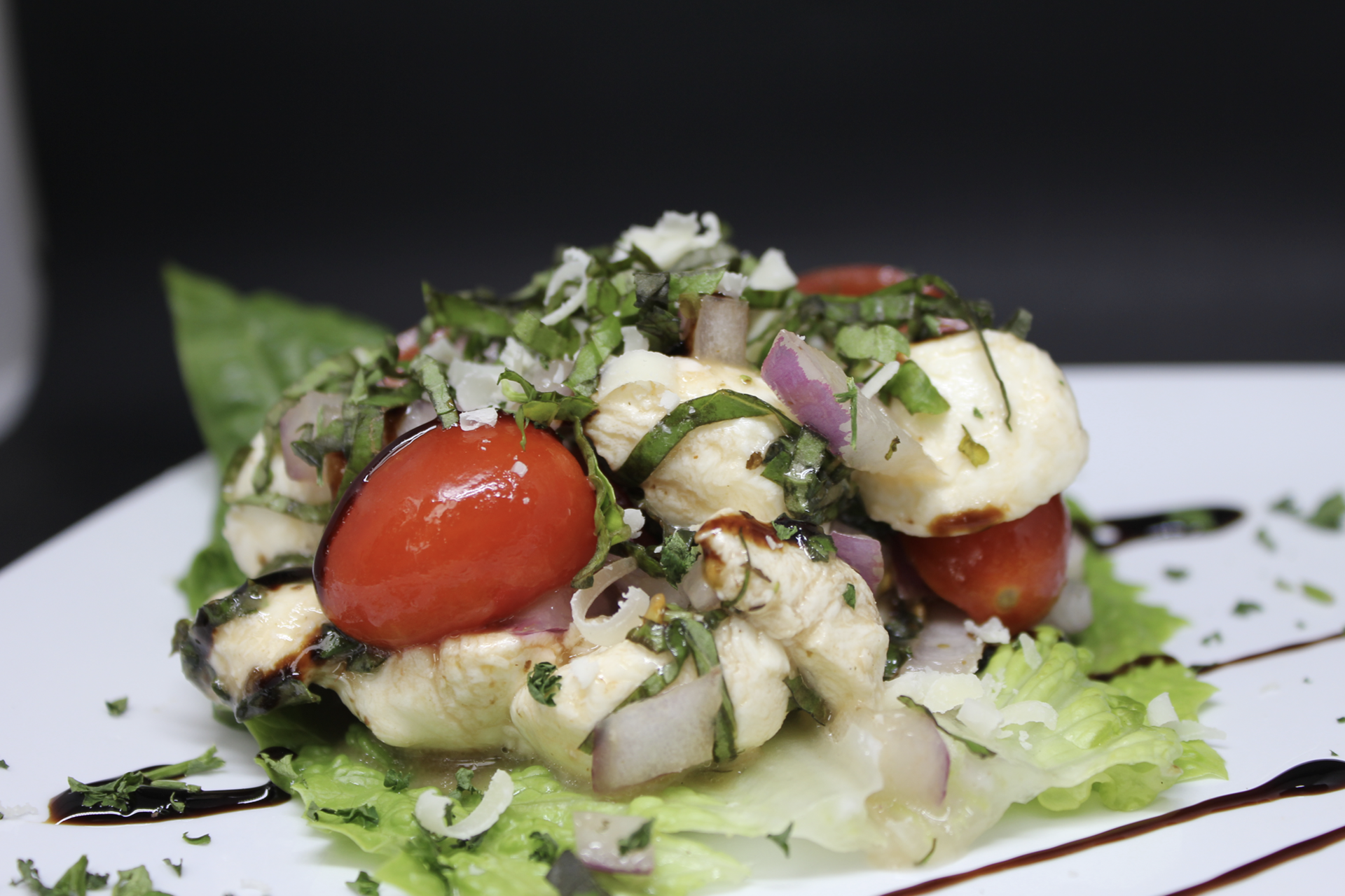 A refreshing mix of mozzarella pearls, crisp red onion, and juicy cherry tomatoes tossed in a light vinaigrette. $10.00
