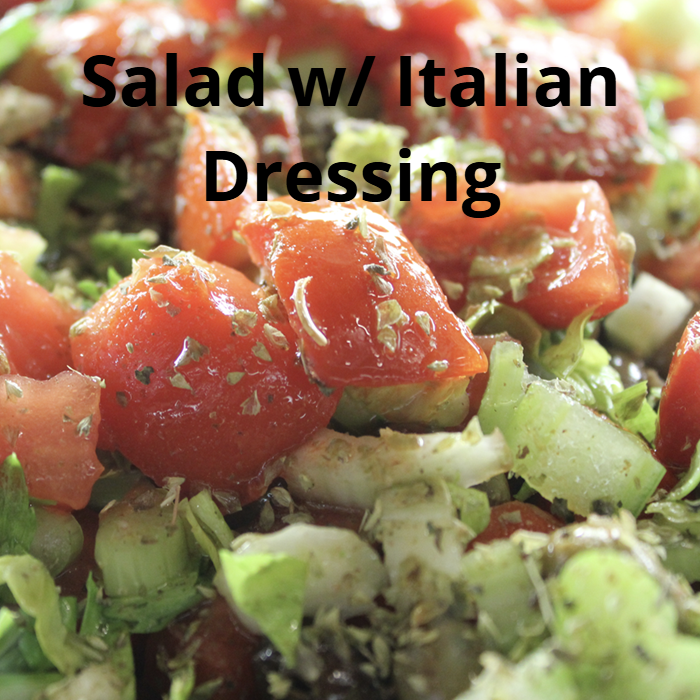 A fresh salad drizzled with a homemade Italian dressing made from extra virgin olive oil, white balsamic vinegar, lemon juice, honey, Parmesan cheese, black pepper, sea salt, Italian herbs, and oregano.
