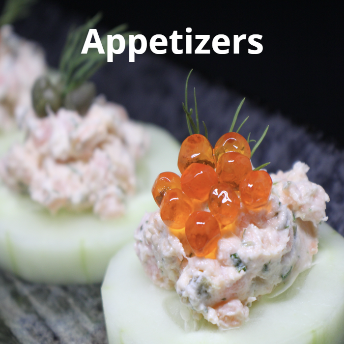 An assortment of delectable appetizer recipes, including Pear & Gorgonzola Crostini, Mussels in Saffron Cream, Smoked Salmon Spread, Roasted Pumpkin Soup, Sicilian Caponata, and Spinach Stuffed Portobello, beautifully arranged on a serving platter