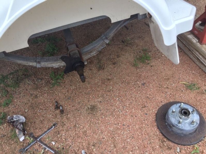A Wheel Is Laying On The Ground — Bohle Welding & Trailer Repairs In Bohle, QLD