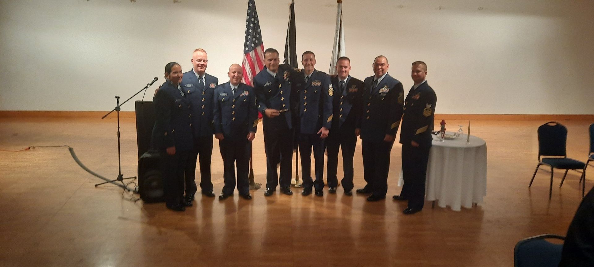 A group of men in military uniforms pose for a picture
