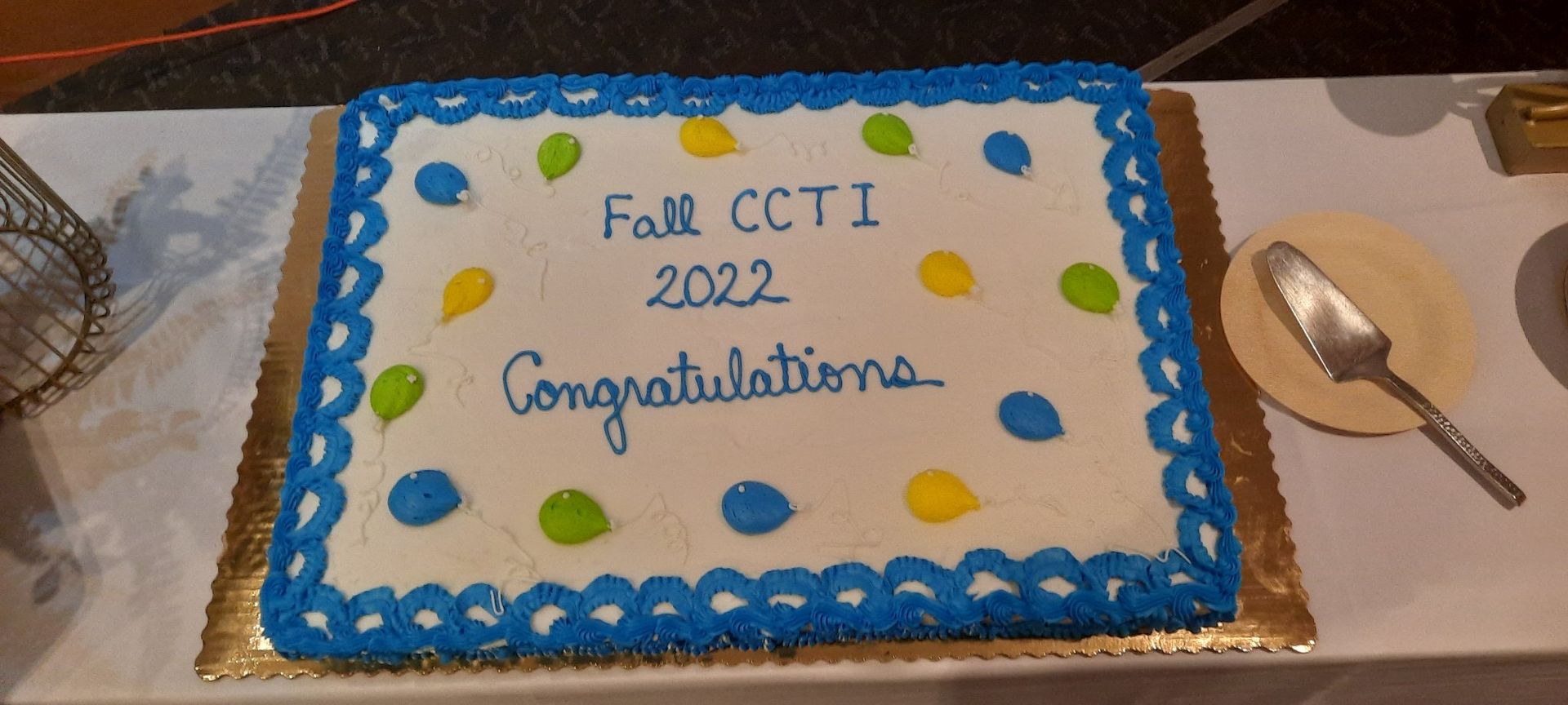 A cake on a table that says Congratulations Fall CCTI 2022