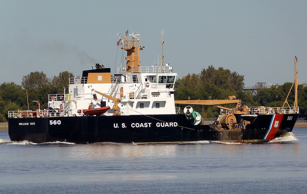 A large u.s. coast guard ship is in the water