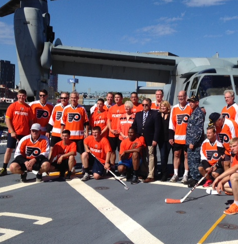 A group of philadelphia hockey players pose for a photo