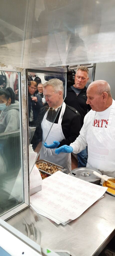 A group of men are preparing food in a kitchen