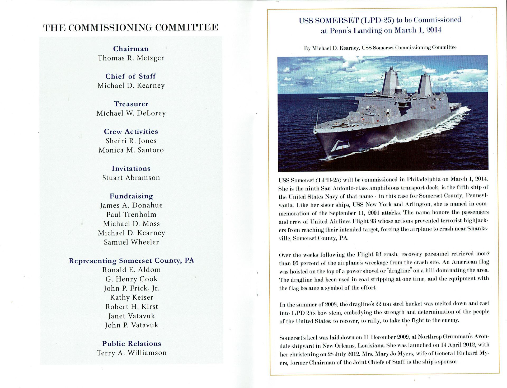A book is open to a page that says the commissioning committee