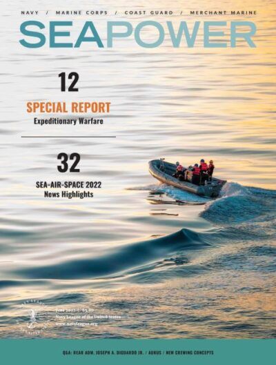 The cover of Seapower Magazine with a boat on it