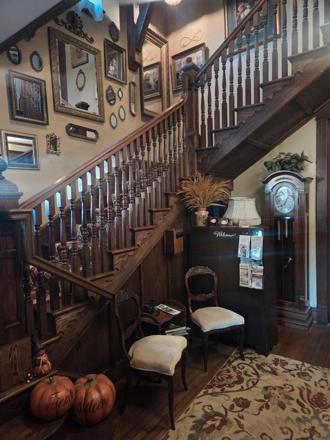 A large brick house with a large porch and stairs