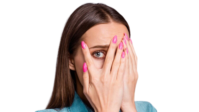 Woman peeking through fingers covering face, pink nail polish, surprised expression.