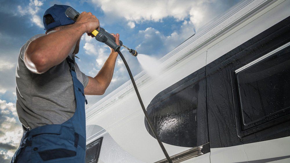 Man Cleaning The RV — Valley, NY — Classic Carpet and Upholstery Cleaning Man Cleaning The RV — Valley, NY — Classic Carpet and Upholstery Cleaning